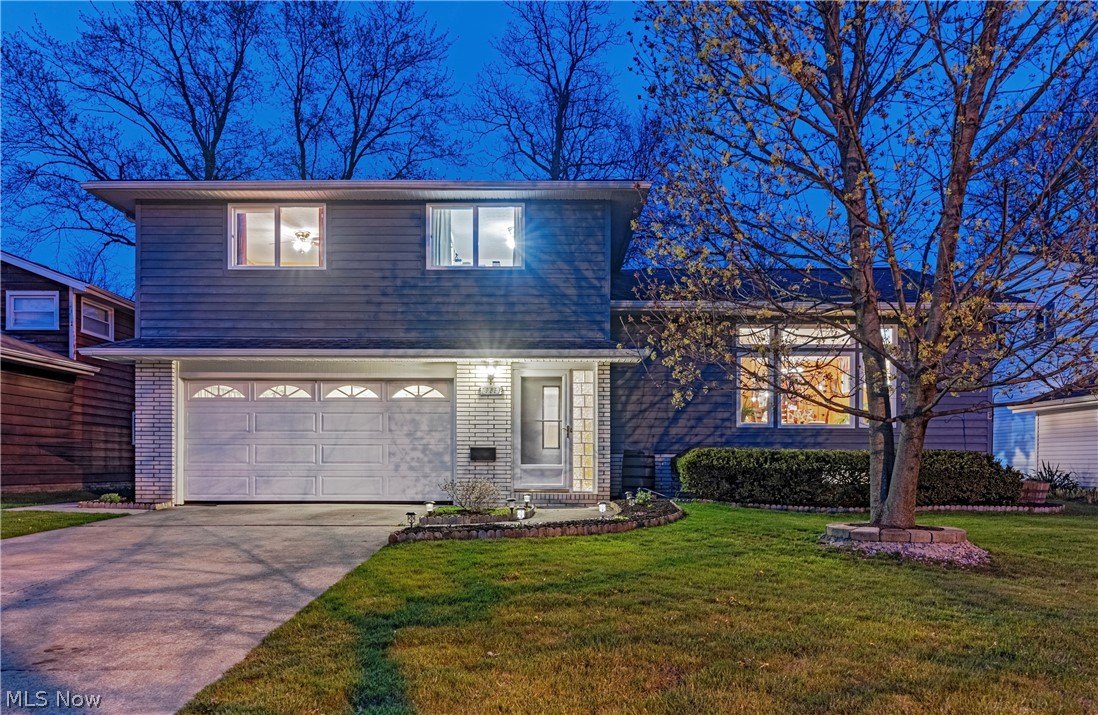 Situated in the heart of Solon, this charming split level provides open living areas, tasteful finishes, and valuable upgrades throughout, plus an exceptional feature that sets the property apart from the rest—not one, but two large additions to provide maximum relaxation, entertainment, and comfort. The main living area is on the second floor, and includes hardwood floors, large windows, and a well-equipped kitchen with a breakfast nook. Here, French doors open to the first addition: a cozy family room with a vaulted ceiling and a fireplace. On the other side of the house, the dining room opens to an incredible entertaining area with a vaulted ceiling, a fully-equipped bar that seats 8, and a sitting area with a fireplace, perfect for game day! The third level offers a peaceful retreat with four bedrooms and two bathrooms, including the primary suite. The lower level includes a second kitchen, a laundry room, and an optional guest bedroom and full bathroom. Beneath the addition, you'll discover an exceptional feature—a full basement that offers storage space and more. This basement has been thoughtfully designed to accommodate all your storage needs. One standout feature of the basement is a specially controlled cooler, perfect for storing kegs or wine. It also offers a wood shop and the convenience of a walk out. Outside, you'll discover a beautifully landscaped backyard. The patio provides a serene retreat. There is also a specially designed clubhouse (with electric). Schedule your private tour today and experience the comfort, convenience, and beauty this property has to offer—your dream home awaits!