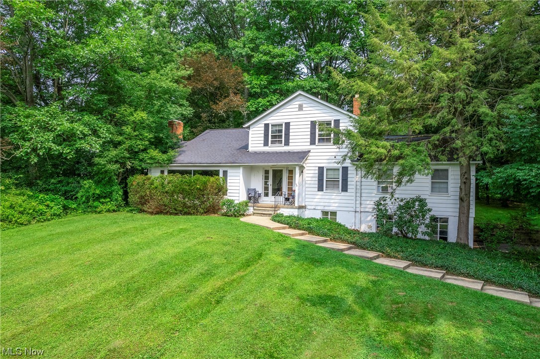 Welcome to Solon's Hidden Gem! This charming 4-bedroom, 2-bathroom home is a rare find in the heart of Solon, OH. Boasting over 2,300 square feet of living space, this property sits on a generous 1.82 acres, providing a tranquil and spacious oasis. Pride of ownership is evident as this home has only had 2 caring owners who have maintained it with love and care over the years. While it could benefit from some updates, the potential to create your dream home is truly boundless. Let your imagination run wild as you envision the possibilities of transforming this house into your perfect abode. Upon entering, you'll be greeted with an abundance of natural light that floods through the large windows, creating a warm and inviting atmosphere. The layout is thoughtfully designed, providing comfortable living spaces for both entertaining guests and enjoying quality family time. One of the major highlights of this property is the exclusive access to a pristine lake within the neighborhood. Here, you can indulge in fishing or take a refreshing swim on hot summer days, making every day feel like a vacation. Located in the highly sought-after Solon area, you'll find yourself near top-notch schools, recreational facilities, shopping centers, and convenient access to major transportation routes. Enjoy the tranquility of suburban living while still having access to all the amenities the city has to offer.
