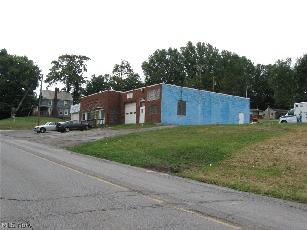 COMMERCIAL BUILDING lends itself to multi-uses! 4,680 square feet with two service bays with overhead doors. High visibility and lots of on-site parking.
