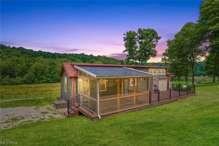 Back on the market at no fault of the sellers! Unique and stunning at the same time.. Check out this adorable 1 BR tiny home or ''getaway'' on 10 acres with a 24x40 pole barn with an attached 12x24 fully enclosed lean to, both with concrete floors and electric. Enclosed lean to is also heated and cooled, making it a great office, workshop, or flex space. Home is fully updated with high end finishes offering stainless steel kitchen appliances including a space saving washer/dryer combo. Interior spaces include a living room, kitchen / dining combo, owner's en-suite with built in storage, extra half bath, and a finished loft. Large deck extends the back of the home including a spacious screened in porch. All has been meticulously maintained. See A2A remarks for important listing information