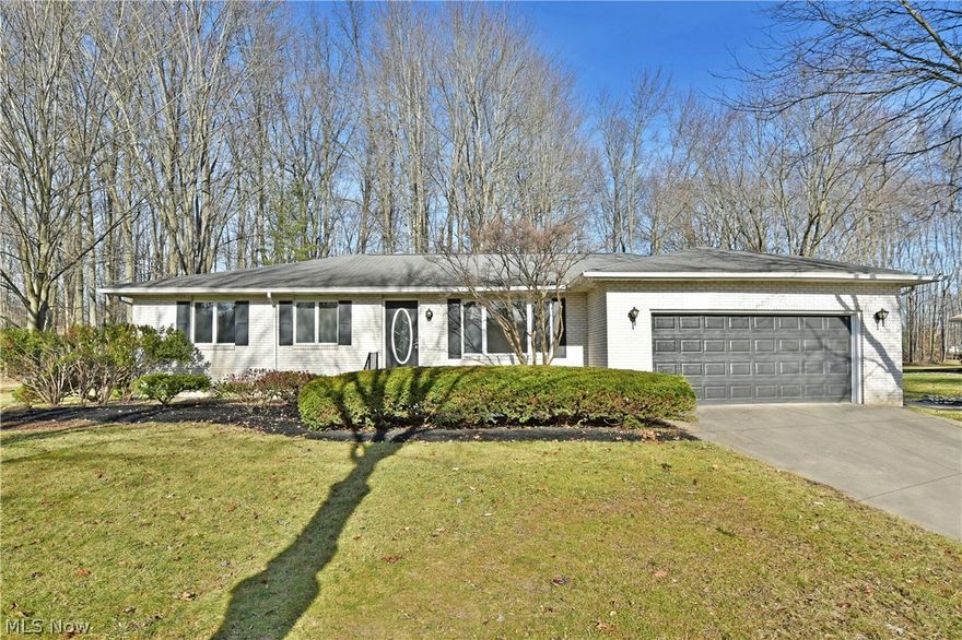 Be the first through the door of this move-in-ready, white brick ranch set in a desirable Howland location! With its good looks inside and out, it’s easy to see why this residence won’t be around for long. The three-bedroom layout quickly announces its presence as it boasts its attractive brick exterior, complimented by dark accent work for a sharp contrast. A concrete drive leads up to the lush landscaping as you make your way through the glass filled entry door. The welcoming living room awaits with its hardwood styled flooring and plenty of sunshine thanks to its oversized picture window. Enjoy a meal in style as the nearby dining room separates the tasteful kitchen. Here, stainless appliances run between the sleek, white cabinets and matching tile backsplash. An impressive family room looks on with its towering brick mantle and inset fireplace. Sliding doors beset the gorgeous, wood trimmed sunroom that overlooks the tree lined backyard. Opposite the home, the main hall transcends