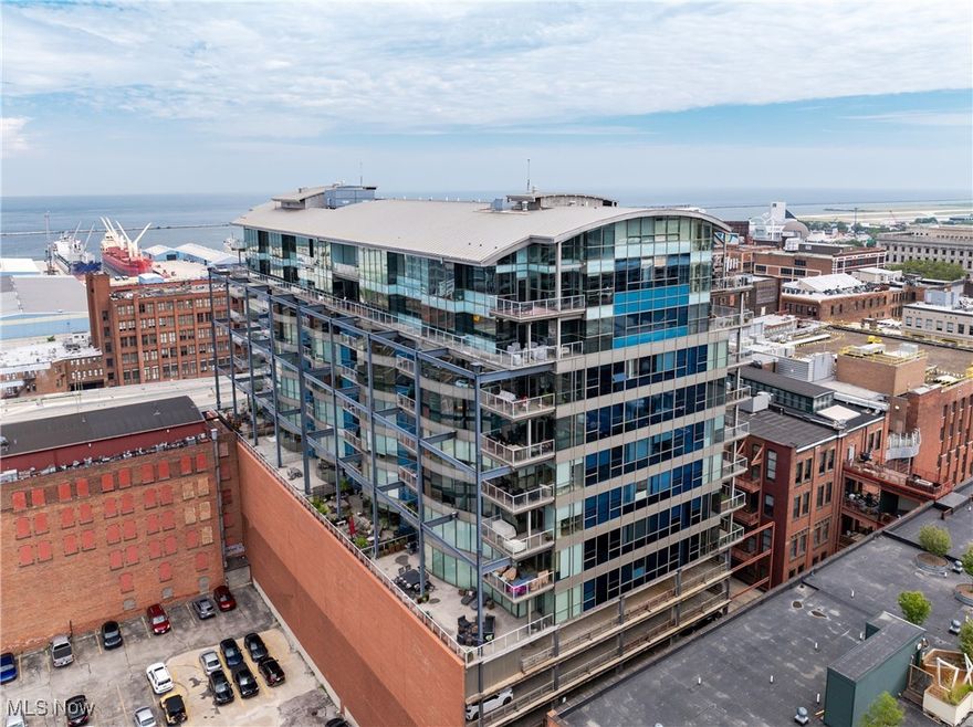 Downtown living starts here—on a 1,200-square-foot private terrace perched above Cleveland’s dynamic Warehouse District. Welcome to Unit 606 at The Pinnacle, a one-of-a-kind residence with floor-to-ceiling, curving glass walls wrapping the entire southwest corner of the building. Bathed in natural light and offering panoramic lake and skyline views, this home defines elevated city living. The open-concept great room, entirely encased in glass, creates a breathtaking setting for both everyday living and unforgettable entertaining. Step outside to the massive terrace—remarkably private and designed for true indoor-outdoor living. Host dinner parties under the stars, lounge with friends in multiple seating zones, grill year-round, and cultivate your own city garden oasis. Inside, the thoughtful layout continues with large bedrooms, three full baths, and expansive walk-in closets. Every room features a wall of windows, bringing in stunning views and light from every angle. Elegant finishes include oak hardwood floors, custom tilework, and refined stone surfaces. A generous utility room and recently updated mechanicals offer peace of mind. Located in one of downtown Cleveland’s most vibrant neighborhoods, you're just steps from award-winning restaurants, the Flats East Bank, and top-tier nightlife. Stroll to Browns games, take in an evening at Playhouse Square, or cross the bridge for a night in Ohio City or Hingetown. Full-service amenities at The Pinnacle include a luxury fitness center overlooking the harbor and stadium, men's and women’s saunas, 24-hour security, and concierge-style living as well as a dedicated pet area for your furry family members. Two deeded parking spaces are included. This is the only residence of its kind in the building—and one of the most exceptional terraces in all of downtown.