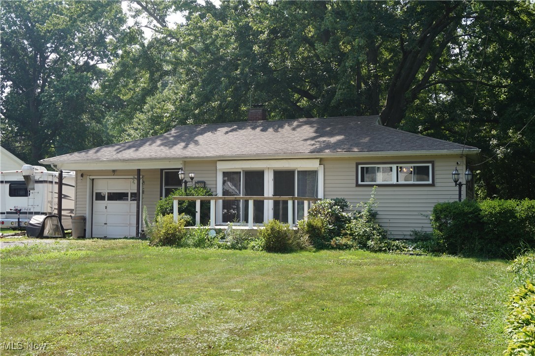 Mid Century Ranch nestled on just over one woodland acre near the shores of Lake Erie. This gem offers 3 bedrooms, one full bath, efficient galley kitchen, open living room/dining room with 2 sliding doors that open to a new deck, gleaming hardwood flooring, full basement with laundry, stubbed off plumbing for bath, walls built for additional living spaces. Attached garage, patio in rear, 12' x 12' deck in front, large graveled driveway, garden shed, access to Lake Erie Park with an small annual fee. Plenty of space for addition or out building. Great location: Near Lake Metro Park Arcola Creek Estuary & Erie shores Golf Coarse, 30+ wineries, Geneva State park & Marina, Genenva-on-the-Lake, covered bridges, Historic Ashtabula Harbor restaurants, yacht clubs & galleries, Spire Institute, Lake Erie beaches, area orchards and fruit farms. If you are not afraid of a few projects and looking for adventure bring your golf clubs, fishing poles, kayaks, paint brushes, hedge trimmer and hammer. This is sure to be a rewarding and wonderful life for you or shared experience as a vacation rental property.