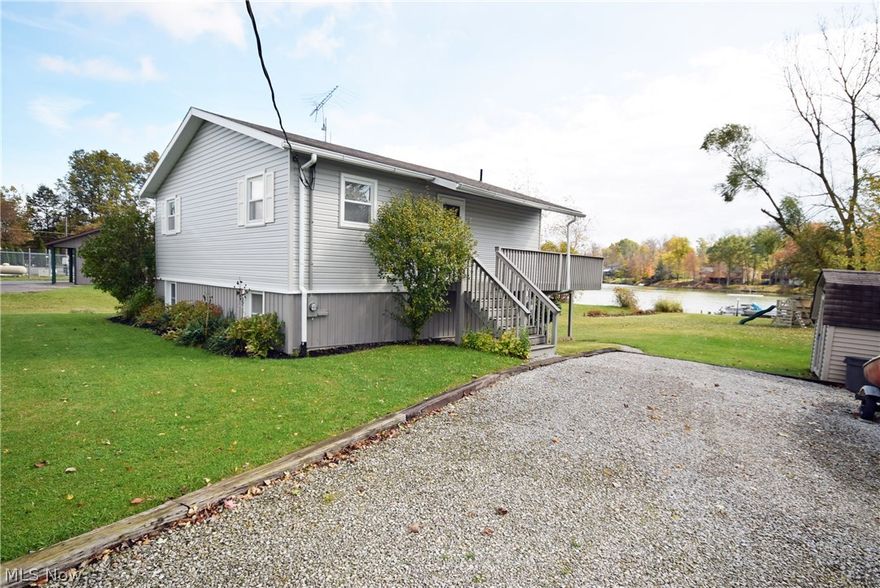 Exceptional condition with this 2 bedroom, 2 bath Cinnamon Lake home.  Convenient walk out from kitchen onto walk-out covered concrete patio viewing the  lake.  Nice relaxing deck and private dock area.  Great fishing on quiet lake, friendly community for year round activities. Nice appliances include refrigerator, stove/oven, microwave, dishwasher, garbage disposal, washer and dryer. Great storage area, 2nd flue if a wood burning fireplace is desired.  Tasteful neutral decor, very clean home.  Vacant lot #498 Carum Place included.  Great opportunity!  Call if you need fee schedule emailed to you or list of amenities. Last 3 photos are of vacant lot. This Realtor would love to own this site!!