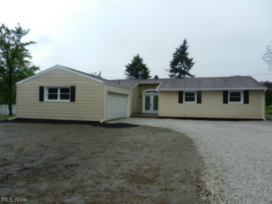 Awesome ranch home with impressive entrance area. Newly remodeled, all natural decor. Move right in and enjoy as all the work has been done. New windows, doors, vinyl siding, bathrooms, kitchen, ceramic tile, carpeting, light fixtures, insulation... too much to mention. Come see for yourself! (Deck to be added in back.)