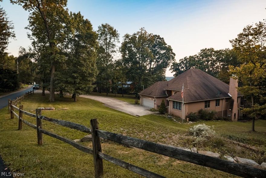 Classy, Beautiful, and Peaceful is just a few words to describe this custom modern design home sitting on 5.8 acers. You will love the natural light, high ceilings, and open floorplan this home has to offer.  The kitchen opens up to a large living room with a cozy fireplace, and walks out to an outside deck overlooking the woods. Entertain large gatherings in the eat in kitchen and spacey dining room. There is 3 bedrooms and a den (could be 4th BR) included on the main floor. The master bedroom includes sliding doors that walk out to a peaceful deck. Soak in the jetted tub surrounded by nature, and enjoy your own sink to brush your teeth with the double sink vanity. All the bedrooms have plenty of closet space, and room to move around. The basement includes a family room with a fireplace and a large full bathroom.  There is a 2 car attached garage and a basement garage for all your lawn care tools and handyman projects.  If you should need more garage space, there is a second driveway