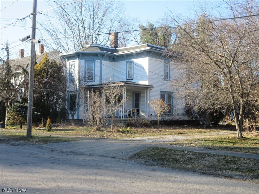 Two-story, four-bedroom, two-bath home built in 1890 blends historic character with the functional layout of a classic American family house.