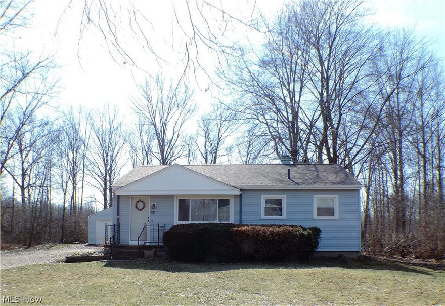 This home is USDA loan 100% financing eligible = NO down payment needed!! This cozy 3 bedroom ranch home offers a living room with newer carpet and built-in shelving. Kitchen has breakfast bar, plenty of cabinet space, and appliances staying. Remodeled bathroom in 2011 with new mold resistant drywall, light, toilet, vanity, mirror, bath fixtures, tiled shower and tile flooring. Master bedroom with carpet. Two additional nicely sized bedrooms with hardwood and newer carpet flooring. Huge full DRY basement that is neat and clean. Outside offers a nicely sized enclosed porch perfect for summer nights bug free! Two car detached garage with new doors in 2015. Private park-like setting. Updates include: All new Polaris high-efficiency windows in the entire house 2011, carpet 2012, roof with transferable 50 yr. warranty 2015, air conditioner wall unit 2015, sump pump 2015, exterior doors 2015, furnace was checked & serviced and all air ducts were cleaned and sterilized 2015, and glass block w