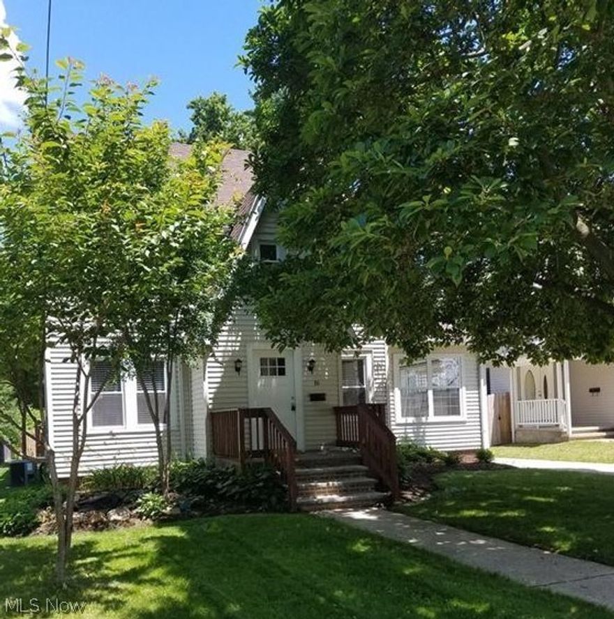 Move right into this completely remodeled 4/6 bedroom colonial with beautiful old world charm. This spacious home features a nice foyer, living room with fireplace, formal dining room with chair rail and tray ceiling, sunroom, beautiful kitchen with new counter, cabinets and ceramic floors. The upstairs has four bedrooms and 2 remodeled baths. The basement includes a finished rec -room, laundry room, half bath and two additional finished rooms that could possibly be bedrooms. There is a 23 X20 deck out back and an oversized two car garage with a large work room addition.  Updates include a newer roof, freshly painted throughout, carpet, ceramic floors, landscaping, updated baths and kitchen.