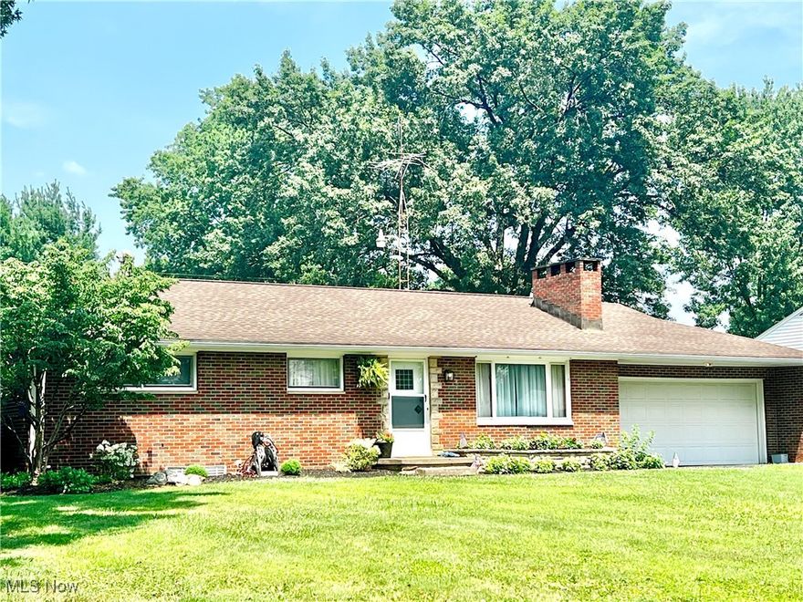 This spectacular brick ranch in Shrine Village features three bedrooms and two full bathrooms. The impeccable interior boasts a welcoming entry, neutral decor throughout, and a spacious living room with a custom white stone accent wall, a wood-burning stove, a large picture window, and plush carpeting. The gorgeous kitchen is equipped with quality cabinetry, a tile backsplash, stainless steel appliances, and ceramic tile flooring. The adjacent dining area offers direct access to a beautiful and spacious deck, overlooking a large backyard complete with a firepit and patio area. The finished lower level includes a recreation room, a built-in bar, a full bathroom, and a laundry area with a washer, dryer, and wash tub, along with ample storage space.  Additional features include; gas heat, central air, and city utilities. This property is a must-see and won't last long!  (may need extra possession time).