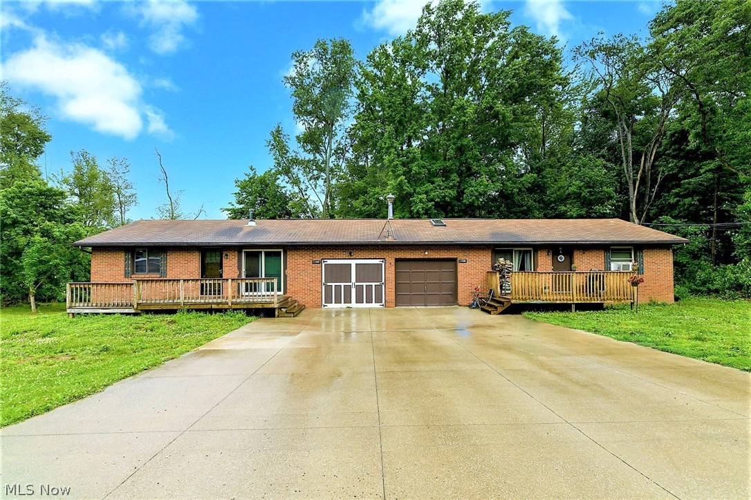 **FABULOUS One Floor Living Ranch DUPLEX In Lake School District, Uniontown, Ohio Showcases 2,600 Sq. Ft, 2-3 Bdrms & Partial FINISHED Basement Per Unit On 1 ACRE Of Land!! *Multiple DECKS Include Front AND Back Tiered Decks To Sit Outside & Enjoy The Seclusion Of This Amazing Location! *Home Sits Far From The Road W/Great Side Yard Space For Cookouts & Family Gatherings! *IMPRESS YOUR GUESTS W/An Extra Large Living Room ~ Can Be Split Up For OPEN CONCEPT Living & Dining Area! *Stone Accent Walls & Woodburner, Ceiling Fans *Kitchens W/Sliders To The Back Deck *Each Unit Has 2 Bdrms On The Main Floor +PLUS+ BONUS Rm/3rd Bdrm On Lower Level + Extra Area For Recreation Or Gaming Rm!! *Unit 11494 Has A Completely REMODELED MODERN Full Bathroom W/Triple Sconce Lighting, TILED Flooring, Expresso Vanity W/Modern Grey Countertop & CUSTOM TILED Shower W/Mosaic Tile Inlays, Frameless Doors ~ WOW! Updated AO Smith 50 Gal H20 TANK 5/2020, FURNACE 2002 + Added Basement Ductwork Hvac For Lower Level