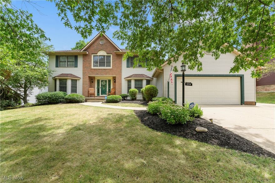 Welcome to this stunning two-story home that perfectly blends elegance and functionality. Step through the front door into a spacious foyer. The front room features built-in bookshelves and rich wood wainscoting. The office space is equipped with built-in bookshelves and a desk. The formal dining room is elegantly designed. The kitchen is the heart of the home with wrap-around granite countertops, a breakfast island, and a stylish backsplash and is equipped with stainless steel appliances and a farmhouse sink. Cozy up in the living room, which has a charming window seat, a gas fireplace, and built-in cabinetry. The sunroom is enhanced by new skylights. The main-level bath features a vanity sink with a granite countertop. To the other side of the hall is a laundry/mudroom. The luxurious master suite includes a spacious 6x10 walk-in closet with built-in shelves and an en-suite master bath with a large walk-in shower featuring dual shower heads. The bathroom also includes built-in cabinetry and a large vanity with dual sinks. There are three more large bedrooms on this floor. The guest bath offers dual sinks, a shower/tub combo, and a linen closet. Entertain with ease in the basement, which includes a wet bar and large rec space including a family room and game area featuring a 9' slate Dakota pool table, built-in cabinets, and a gas fireplace. The basement also includes a large bedroom and full bath. The attached two-car garage is equipped with electric service, a drain, and an additional refrigerator, providing plenty of space for vehicles and storage. The backyard is an entertainer’s dream, featuring a large pergola-covered deck with a built-in stone fireplace, a stamped patio, built-in gas grill and a heater. To the other side of the sunroom is a charming gazebo, creating an outdoor oasis for relaxation and entertainment. This home is a perfect blend of luxury and comfort, offering everything you need for modern living.