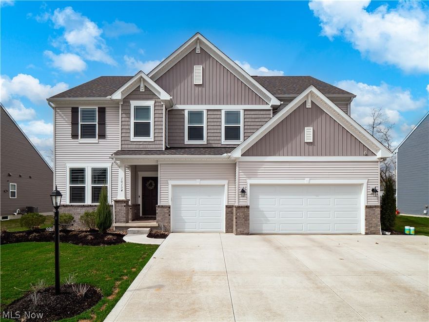 Exquisite New Construction in Strongsville offering 4 bedrooms, 3 baths, and an unparalleled blend of luxury and thoughtful design. All bedrooms are privately situated on the second floor, including a lavish owner’s suite with dual vanities, a spa-like shower, and two expansive walk-in closets, while a convenient second-floor laundry room enhances everyday living. Designed for both grand entertaining and refined comfort, this home showcases a stunning enclosed patio with fireplace, heaters, and an adjacent outdoor kitchen, along with a gourmet interior kitchen featuring premium Thermador appliances, custom finishes, and a spacious pantry.

Step inside to discover a serene, modern aesthetic with soothing, upscale finishes and laminate hardwood flooring flowing seamlessly throughout, including the beautifully finished basement. The lower level offers an impressive recreation space along with a dedicated private gym, creating the ultimate retreat for relaxation and wellness.

The main floor is thoughtfully designed with a stylish half bath, private office for work-from-home convenience, and a functional mudroom complete with custom lockers. The 3-car attached garage is a standout feature, boasting epoxy flooring, heat, a 200-amp EV charger, and built-in cabinetry.

Entertain effortlessly with a custom bar featuring a fridge and fridge drawers, while additional upgrades such as Hunter mechanical blinds, California Closets, a barn door with loft shelving, and a newly updated half-bath vanity elevate the home’s sophistication. The exterior is equally impressive, featuring fresh sod, professional landscaping, irrigation, and stunning gemstone lighting that enhances the home’s curb appeal day and night.

This exceptional residence offers a lifestyle of elegance, comfort, and modern convenience—truly a must-see.