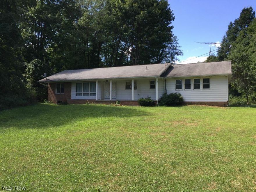 2 Acre secluded ranch with 2 car garage, & partially fenced treed lot. 3 bedrooms, 2 full baths, full basement. Large front porch. Needs TLC. 
No sign in yard.