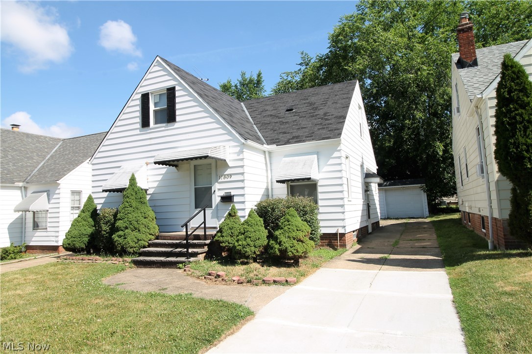 Welcome home to this totally updated, charming three-bedroom cape cod. Come on in to enjoy the new flooring, new lights and windows, freshly painted throughout this bright and cheerful home. Large living room with built in shelves. The beautiful kitchen offers abundant of cabinets, and all new counters, back splash, new appliances. There are two bedrooms with ceiling fans and an updated full bathroom on the main level. Upstairs you will find a large bedroom with built in shelves. The lower level is partially finished, great space for TV room, work out area, office etc. Plenty of storage space. Outside there is a new back deck, new back door and two car detached garage with new garage door. WOW! Nothing to do but move in!
