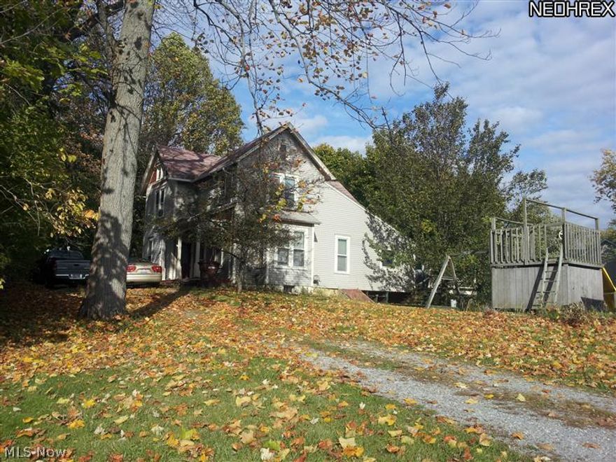 Lovely, large century home with many updates! 5 full bedrooms.  2 Full baths on the first floor, half bath off attached to the Master Bedroom. idyllic 1 acre lot complete with tool shed and barn/stable.  Beautiful country setting less than 1 mile from Hartville. Large Kitchen with window nook.  9 foot ceilings on the first floor, hard to find metal decorative ceilings in the second floor bedrooms.  Working wood burning fireplace in the living room.  Potential Office area with it's own outside access door.  Finished rec room off the laundry room in the basement.  Separate basement area for mechanical and work rooms. Walk up attic with lots of storage.  Priced for quick sale.