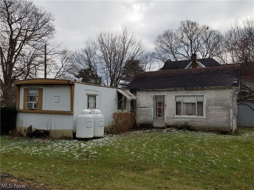 Nice corner lot on Votaw and East Lake Road.  Mobile home is not habitable. Needs removed. Could he a nice building site. Lot is 145 x 60. Being sold "As Is".  Needs court approval after contract received. About 2 weeks.