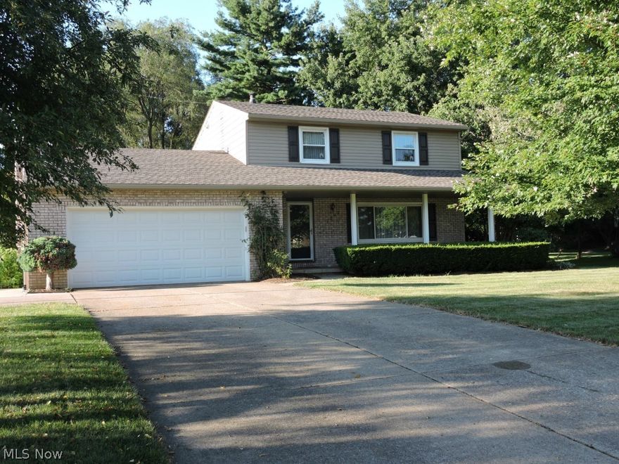 Opportunity Knocks in Jackson Township.  Owner has taken great pride in updates over the last 10+years...full list available at house.  Spacious rooms, plenty of closets and storage areas.  Open 23 x 6 front porch and a 21 x 12 summer enclosed patio off french doors from Family room.  Large backyard with storage shed (tree line at storage shed and to the front of house is lot line).  1st floor laundry, cozy fireplace in Family room, eat in kitchen & formal dining room for Holidays and entertaining.  Large Master BR, with all three BR's having hardwood floors. Basement has finished rec room, and 4th BR/play room/office area with double closet.  Back basement holds utilities and storage with extra storage under Family room.  Close to shopping, banks, YMCA, schools, CAK airport 10 minutes away, easy access to freeways....Great Community to call HOME!  Call to preview TODAY!!