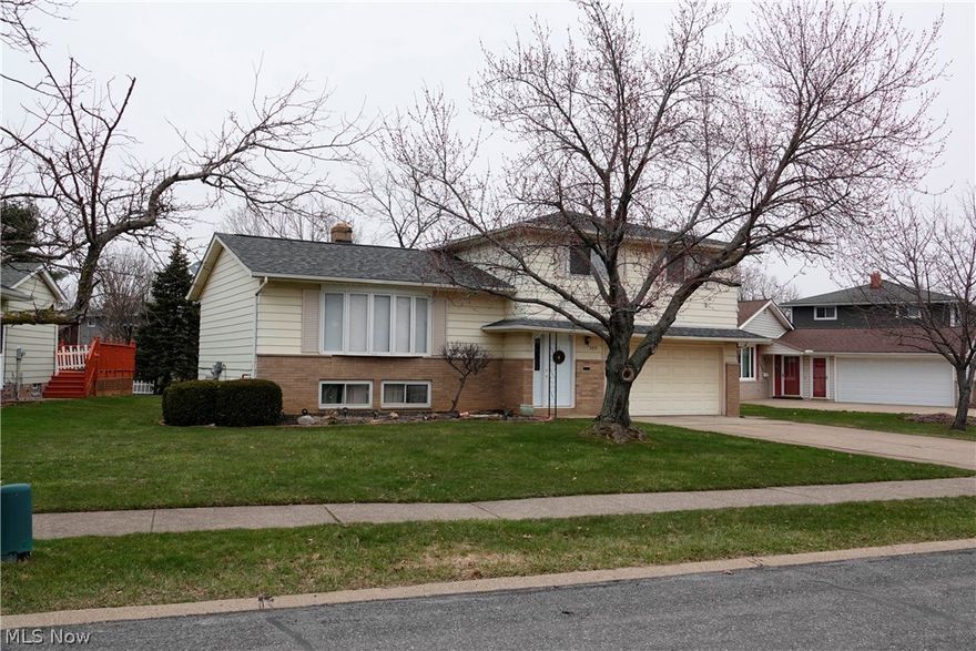 Spacious 4 bedroom, 2.5 bath home with a new roof (2016), wood floors, formal dining room, newer carpet and paint throughout.  Finished lower level.  A must see!!