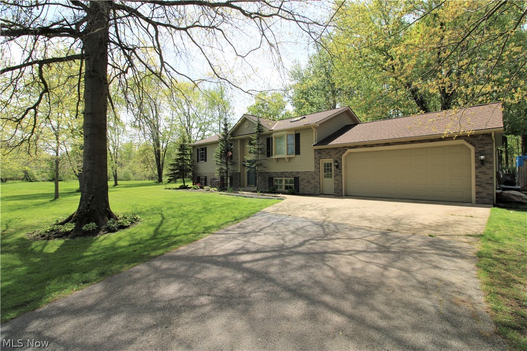 Location..Location..Location!! This sought after GENEVA TOWNSHIP 4/5 BEDROOM BI-LEVEL HOME offers so much SPACE! All sitting on a Robust 3 plus ACRES! The Main Floor offers a Roomy, Quaint Eat-In Kitchen/Dining room area with Patio Doors to Deck, overlooking backyard full of Woods & Wildlife and fenced in area! Relaxing Living Room, Main Master Bedroom with private bath, 2 more nicely sized bedrooms, full Bathroom on First Floor! Downstairs to the very large GREAT ROOM, Bedroom times Two, Office Space or Recreational area! Cant forget the Expansive sized Laundry room. Moving Outdoors too a Beautifully Landscaped Yard, Attached 2 car garage and a Paved Driveway w/turn around. Home sits back off the road, quiet and peaceful! Don't want to miss out on this home! Schedule your showing today