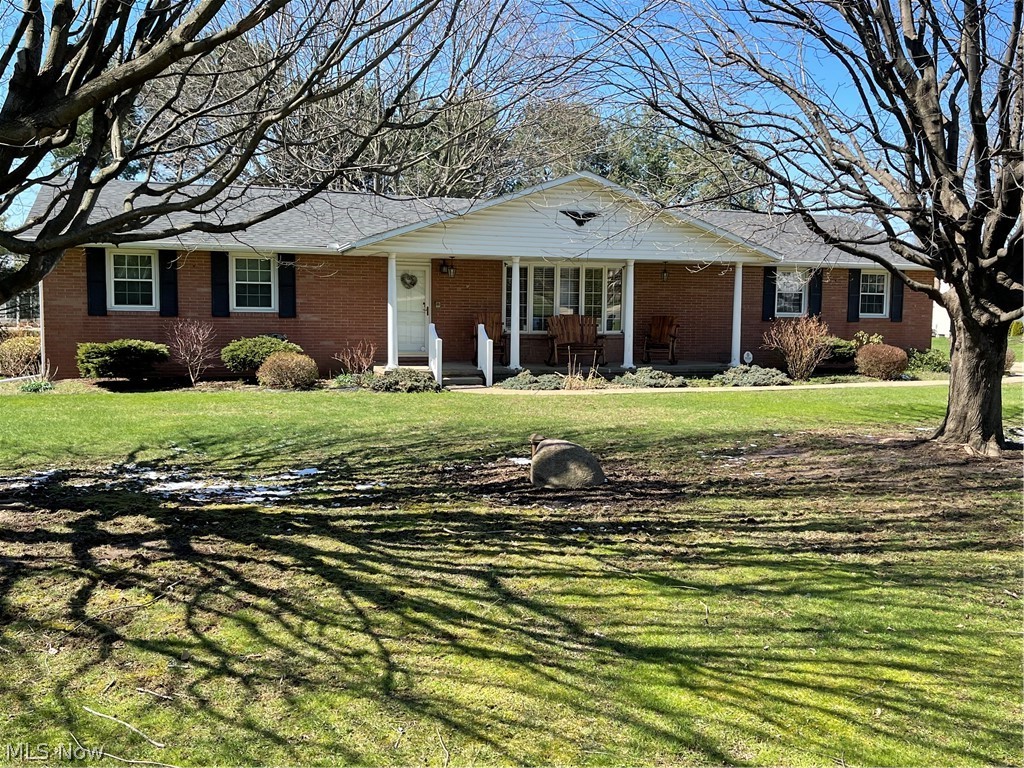 This quality built brick ranch has a special charm and a custom built floor plan ideal for multiple living situations. Corner lot with extra parking. Carpeted Sunroom with newer windows. Hardwood floors. First floor laundry in hall closet. Fireplace in the open dining and small kitchen area. Front living room with beautiful bay window. Two bedrooms on the first level. The master bedroom has an extra large closet with an attached full bathroom with shower stall.
Access to the lower level is through the garage. A second kitchen, full bathroom, closet area, living area, and workshop are awaiting your further usage.