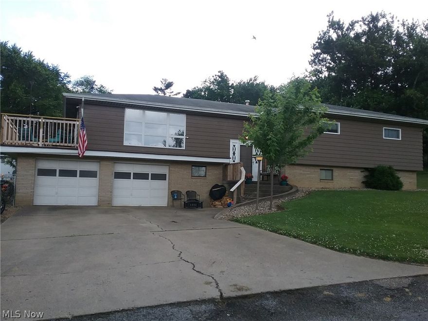 This is a must see!!! House is on a quiet, dead end street and is the last house on the street, very private.  Lots of rooms, lots of space and tons of storage.  This is a split entry home with Living rm, Eat in Kitchen, Dining rm, 3 bdrms and full bath on main floor.  Bdrms each with a minimum of 2 closets and 1 with 4 closets.  The pantry off of the kitchen has floor to ceiling cabinets.  The living room opens to a wood deck that overlooks the large, fenced yard thats almost 1/2 acre, great for children and pets.  Downstairs there is a large family room with bar, sink and fridge.  There is an additional room that currently houses a fourth bdrm and would make a great play room/ game room or remain a guest room.  An Addition to this room is a private office. The laundry/utility room is in the lower level and there is another full bath also.  Access to the oversized 2 car garage is from the lower level.  This home has mostly new flooring and lighting throughout.  Drive way is paved.  50