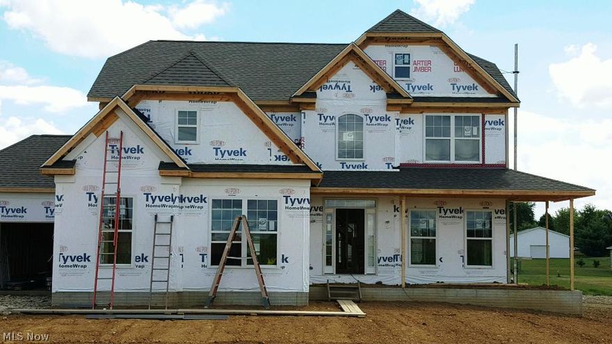 What a find!  New Construction in Lake Schools on a wonderful lot with super country views.  This 2626 sq ft home features hardwood floors throughout the kitchen, hearth/gathering room, dinette, foyer and half bath on first floor.  The kitchen is a true focal point of this home with incredible family and entertaining space.   Bosh appliances (refrigerator not included), granite kitchen counters, Maple cabinetry with mold detail trims, 9ft ceilings on entire first floor, over sized painted trims, fireplace in great room with additional gas fireplace in hearth room, 2nd floor laundry, master suite with water closet.  Exterior has a wonderful porch to enjoy the great views on warm summer nights and composite deck with vinyl railings.  The additional custom details features 92+ efficient furnace, Metal spindle details on stair case, rough in for full basement, walk in closets with tuff-n-dry 30 year transferable warranty and best of all- city water and city sewer.