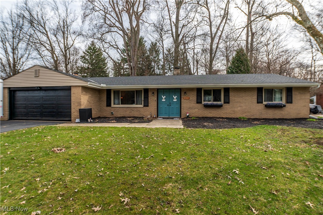 Discover the charm of this ranch style home at 8063 Rolling Brook Rd in Sagamore Hills, OH, nestled on a private lot with a treed backyard. Step inside to find a spacious interior featuring three bedrooms and two full baths. The modern living room boasts newer luxury vinyl floors, creating a welcoming space. Adjacent, the dining area opens to a well-appointed kitchen, ideal for hosting gatherings or enjoying quiet nights in. The kitchen flows effortlessly into another living area, complete with a sliding glass door that leads to the backyard, that has a tucked away path leads you to a cozy fire pit, perfect for relaxing evenings outdoors. Recent updates, including a new roof, siding, gutters, and refreshed bathrooms, ensure both comfort and peace of mind. Complete with a two-car garage, this home is move-in ready. Call Brandon today to schedule a private showing today!