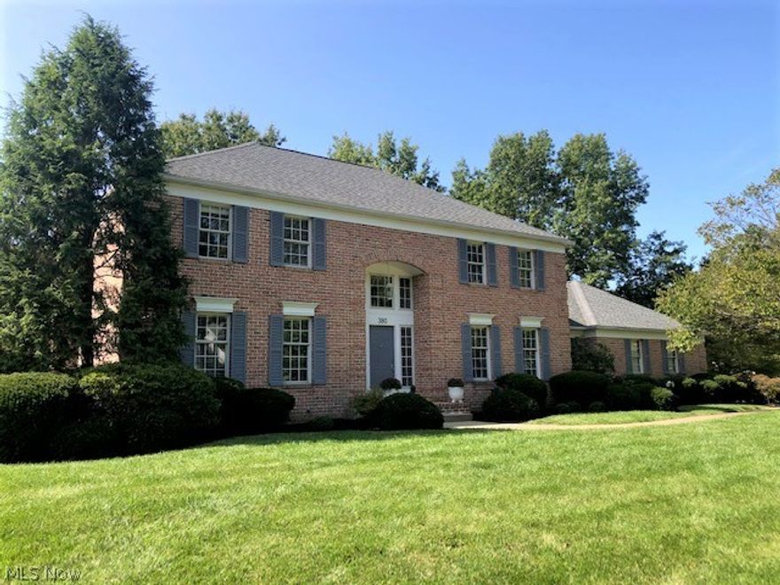 Stately all brick colonial in the heart of Fairlawn highlights the mature treed yard and pond.  Welcoming entry to gracious foyer features ceramic floors and open curved staircase. Formal living and dining rooms offer neutral decor, crown/chair/picture frame molding, and sunfilled light.  Engaging family room boasts mantled fireplace, wainscoting, built-ins, and French doors to composite deck.  Updated white kitchen features a center island, abundance of cabinetry, planning station, separate eating area with octagonal vaulted ceiling, and access to deck.  Convenient full bath, spacious laundry room, and an adjacent office complete the first floor.  Inviting master suite presents a glamour bath with double sinks, jetted tub, separate shower, and skylight. Three additional sizeable bedrooms, main full bath, and catwalk are on the second level.  Unfinished basement allows for ample storage and/or finishing to buyers discretion.  Newer brick walkway leads to massive deck with views of land