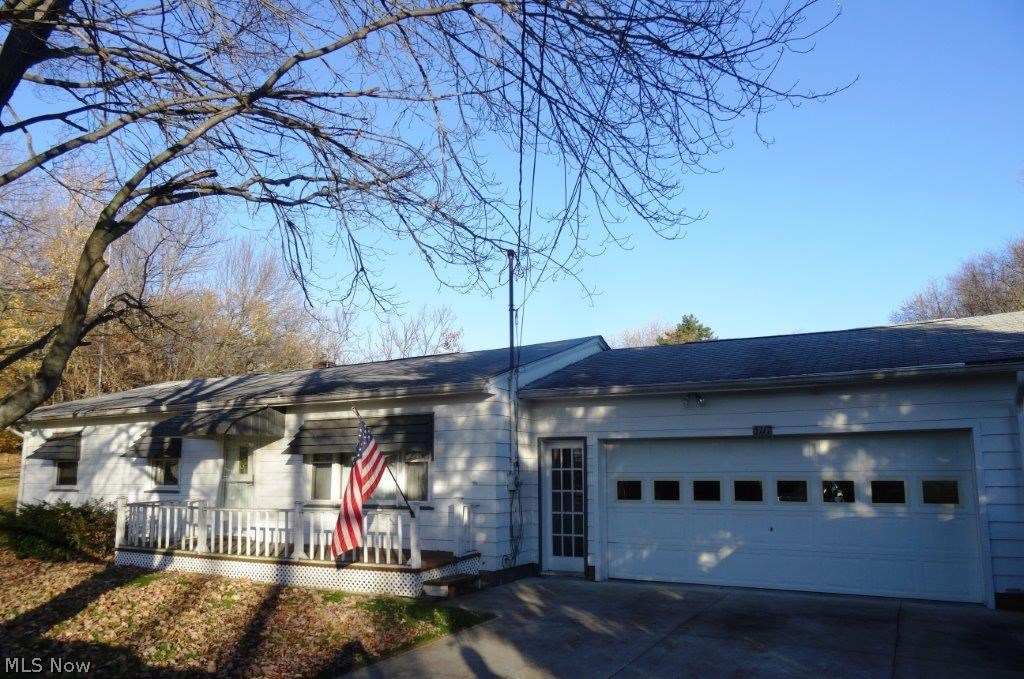 Hard to find neat and clean 3 bedroom ranch on a huge lot in Green! One floor living includes three nice sized bedrooms, full bath, attached 2 car garage, front porch and back deck, and a spacious flat lot with a big back yard! Kitchen includes refrigerator and oven/range, washer/dryer also stay, hardwood flooring in living room and all three bedrooms is in very good condition. Driveway re-paved 2011, furnace/AC/hot water heater all 2008, updated vinyl windows, schedule today to make this home yours!