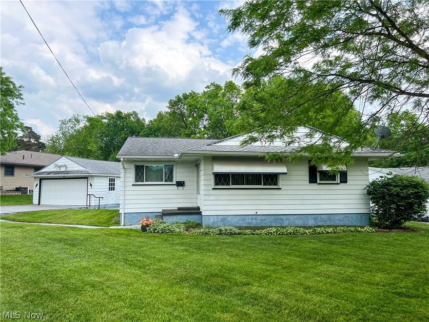 3 bedroom ranch home in the heart of Niles! The home is situated on a corner lot. The front porch leads in to a living room that opens to the kitchen & dinette. All appliances stay (stove in new!). 3 bedrooms and a full bath are at one end of the home. Hardwood floors run below the carpet. The full basement is finished and waterproofed. It features a custom retro bar, rec room, storage spaces, full bathroom & laundry room. Large covered back porch, 2 car detached garage, and a nice yard complete this home! Home warranty is provided for worry free purchase! Call today!