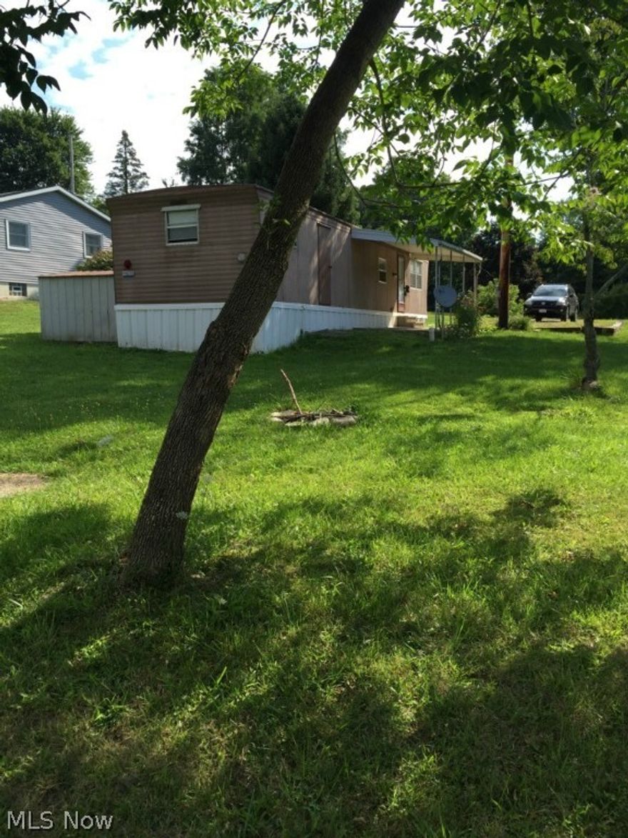 Low Cost, Low Maintenance mobile home on a private city lot.  NO LOT RENT!  This is a rare opportunity to own a unique property and enjoy the benefits of mobile home living, without the restrictions of a trailer park.  Great for a starter home, retirement, or investor-good rental history. The owner updated the electric panel and installed a new furnace in 2014. Washer and dryer hookups are in the laundry/utility room.  Possible private lender financing is available to buyer with good credit.