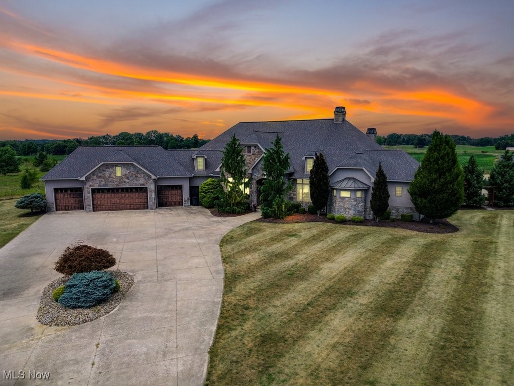 An Unparalleled Legacy Awaits: Exquisite Custom Estate at 1771 Midway Street, Uniontown
Welcome to a world of uncompromising luxury at this breathtaking, fully furnished custom residence. Situated on just shy of seven meticulously landscaped acres, this masterpiece offers an exclusive and private lifestyle. Constructed with ICF (Insulated Concrete Forms), this home provides unparalleled quality. Spanning 6,750 square feet, it features five bedrooms, five full baths, and two half baths. The gorgeous great room and main kitchen serve as the heart of the home, designed for entertaining. The main kitchen has custom cabinets and high-end stainless steel appliances. A second kitchen is also available. A theater room and exercise room with a steam shower provide ultimate amenities. The gorgeous master bath offers a spa-like retreat with a soaking tub and walk-in shower, complemented by a giant walk-in closet. Two other bedrooms share a joint walk-in closet with tons of space. Step outside to a true outdoor oasis with an exquisite in-ground pool and hot tub with Pentair technology. A full pool house, two fire pits, and waterfalls complete this serene setting. This estate is a technological marvel with a Control4 system for lighting, AV, and security. Practical luxury includes a whole-house vacuum system, a natural gas generator, radiant floor heating, and a four-car garage. The property comes fully furnished with high-end furniture and electronics. A Ventrac tractor with a 6-foot mowing deck is included. A hidden walk-in pantry and an invisible fence for pets add to the home’s features. This magnificent estate, known as Scenic Estates, offers some of the area's most picturesque sunset views and is ready for your new chapter of luxury living.
Schedule your private tour today.