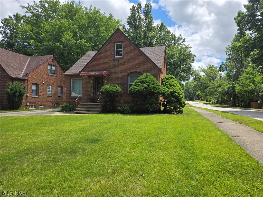 This meticulously maintained all Brick Cape Cod Home could be your NEW HOME! This home has been updated in all the places that matter: newer Roof, Windows and Electrical. If entering through the side door there is a landing where you can go down to the finished basement with a full bath or up one step to the kitchen. From the Kitchen into the DR area & then into the Living Room w gorgeous coved ceiling and arched doorways. 2 BR's on the main floor and the master is on the 2nd floor. Entire interior has just been freshly painted. Full finished basement w full bath. There is a large detached 2 car garage. Gorgeous private corner lot. Close to everything.
