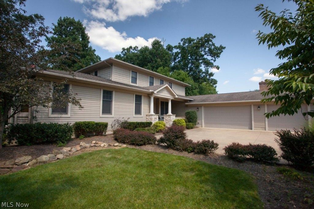 University Woods Gem custom built in 2003. In-law suite on first floor could be converted to Master. Over 3000 sq. ft. with large walkout basement. Custom cabinets with built-ins/Arts & Crafts Movement & Frank Lloyd Wright features.