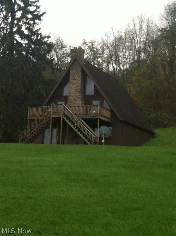 Gorgeous setting for this A-Frame on over 9 acres just outside of Barnesville. Large deck overlooking pond. 32X40 detached garage. Basement could easily be finished with flooring and ceiling to add to the square footage.