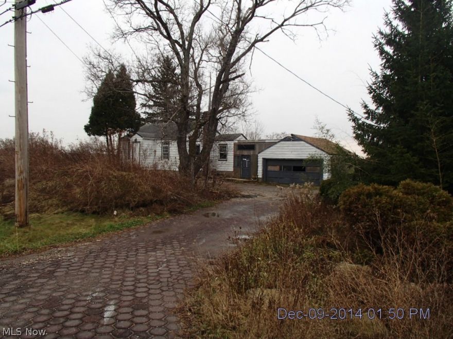 Fabulous price on almost 2 1/2 acres with a pond!  House needs work, but there are many possibilities!  There is also a barn on the property.