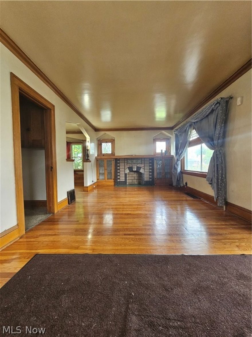 Diamond in the rough!  Big bungalow with 3 large bedrooms. Master on 1st floor.  1 full and 2 half baths / half in basement / half on main floor / full upstairs totaling 3 baths.  Has beautiful original hardwood floors.  Built in cabinets in the formal dining room. Living room has gas fireplace and also has built in cabinets.  All 3 bedrooms are large with nice sized walk-in closets.  Large eat-in kitchen.  Front porch.  Partially finished basement / Good storage in basement as well.  Home needs some work to make it a polished home.