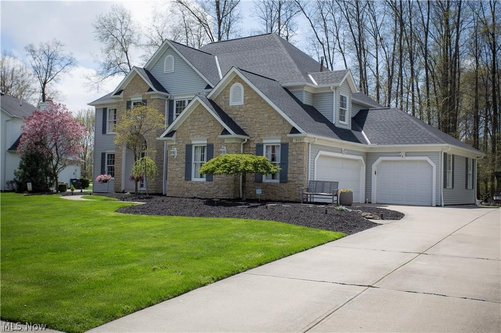 Beautiful 4 bedroom 3½ bath Home in Avon Lake's premiere Reserves of Avon Lake is move in ready! Attractive curb appeal with lush landscaping & over-sized 3 car side load garage. Once inside, you'll appreciate the open two-story foyer flanked by a sitting room & formal dining room with gleaming hardwoods & fresh paint throughout. Impressive family room with a cozy floor to ceiling stone fireplace & access to the beautiful stamped patio with a stone firepit. The expansive eat-in-kitchen boasts a center island with seating, ample cabinetry, granite countertops, subway tile backsplash, beverage cooler, pantry, all new stainless steel appliances & a bright & airy vaulted dining area. The 1st floor is complete with an office with built in shelves, 1/2 bath & a sizable laundry room. The Modern staircase leads to the 2nd floor with a vaulted master bedroom with an updated en-suite master bath. The en-suite bath has so much to offer including closet space, walk in shower, double vanity & a wa