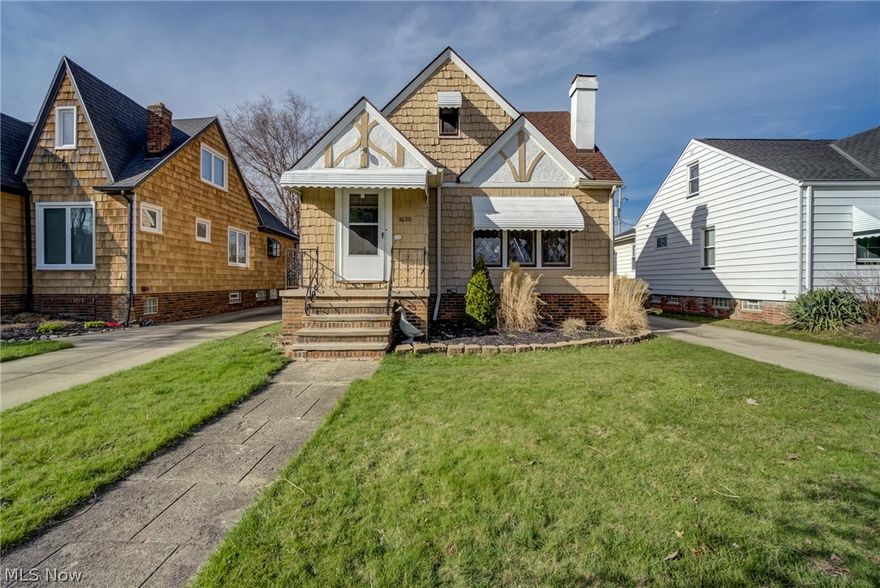 Charming bungalow in convenient location has updates with some original features.  Walk into the vestibule entrance into the spacious living/dining room areas with wood burning fireplace and built in corner cabinets.  The well equiped kitchen has room for a table and all appliances stay.  Enjoy warmer weather on the covered back porch.  There are 2 bedrooms on the main level and 2 more large tandem bedrooms upstairs.  Recent updates include:  roof 2021, chimney tuck point 2021, vinyl floors on mail level 2022, hot water tank 2021.  The  yard is fully fenced and there is also a 2 car garage.  Welcome home!