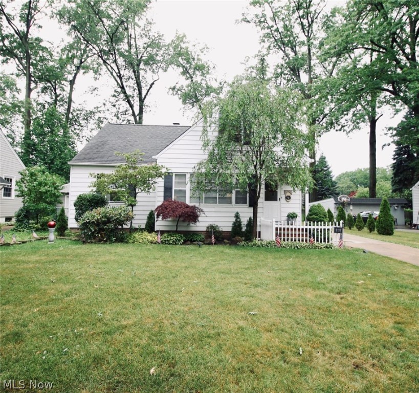 Immaculate Cape with two bedrooms on the first floor and two bedrooms on second. As you enter through the front door you are greeted into the spacious family room, which flows nicely into the kitchen and eat in kitchen area. Nicely updated kitchen with plenty of counter and storage space; there is an opening through to the eat in kitchen for easy access and hutches for extra storage as well. The kitchen flooring was updated in 2010, hardwood floors throughout, as well as dishwasher in 2016 and refrigerator in 2019. The first floor bathroom was completely updated in 2017. The second floor offers two more bedrooms and a second full bath; this bathroom was updated in 2015. The lower level offers a partially finished basement with wet bar and extra shower; glass block windows as well as complete waterproofing on the whole basement. Patio doors from the eat in a kitchen area will take you out to the deck where you can relax or take a nice soak in the hot tub. In 2014 the garage had its st