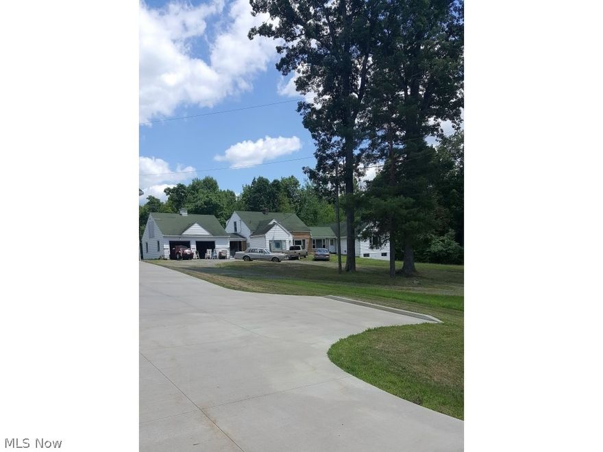 Why not have the best of both worlds? This estate like home has gorgeous views of the main part of Lake Milton and your own private dock along with 6 acres in a country setting. It even boasts a separate guest house with all utilities for to enjoy what this property has to offer! Located on NE River Rd in Lake Milton’s most desirable area this home features  a walkout basement that could easily be finished. There are 5 over sized bedrooms with large closets. The interior of the home has been completely remodeled keeping elements of its charm but giving it that modern relaxed feel. You even get to make the final choices on the flooring in the bedrooms and dining room along with a few remaining choices on light fixtures and hardware. The master retreat is on the first floor and includes a full bath and there are 2 other bedrooms on the first level with private ½ baths. 700 square feet of wide open great room space with refurbished darker hardwood and 2 bar areas make this area perfect fo