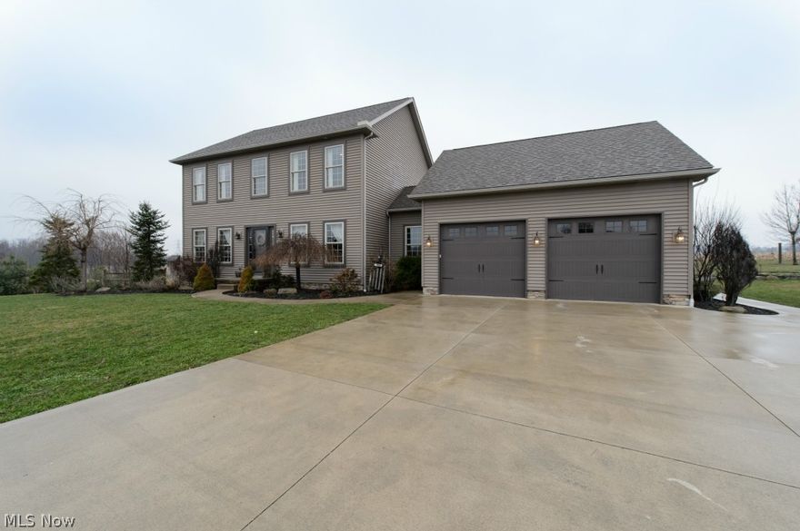 It doesn't get any nicer than this!  Situated on over 3 acres in a private country setting.  From the moment you step into the foyer, you will fall in love with the craftsmanship. Custom milled knotty pine flooring runs throughout most of the home. The kitchen features handmade knotty pine cabinets, granite island that seats 5, Corian counters, a beamed ceiling & is open to the formal dining room.  The living room has a cozy wood burning fireplace.  A private office is also located on the main floor, as well as a convenient first floor laundry & half bath.  Upstairs, there is a large master bedroom with its own master bath complete with double bowl vanity & walk in closet.  2 additional bedrooms share the other full bath.  The walk out lower level provides over 400 square feet of living space & includes a built in entertainment center.  The 13 course basement also has an unfinished area, providing plenty of room for storage and access to the back yard.  Outside, you will enjoy scenic v