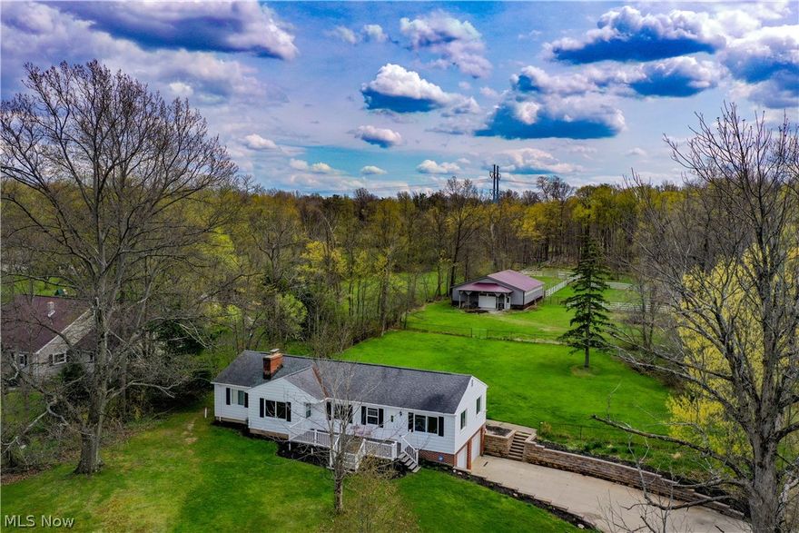 The perfect affordable horse property! A breathtaking four acres of land with a raised ranch and a barn with a metal roof.  Lots of updates!   Bright, freshly painted home allows all the light in. New granite, backsplash, flooring and appliances in kitchen.  (2015)   New electrical wiring, panel, plumbing, furnace, hot water tank (2015).  Wood flooring refinished, new carpet, new back deck (2018), new windows in 2015 and 2021.   New stone retaining walls in 2018.  Must see home.  One mile walk to high school and middle school. Any purchase agreement will require buyer to allow seller access to dig up during the summer, if property has already transferred. Make sure you find the video on your favorite real estate portal. If you cannot find it, ask your agent!