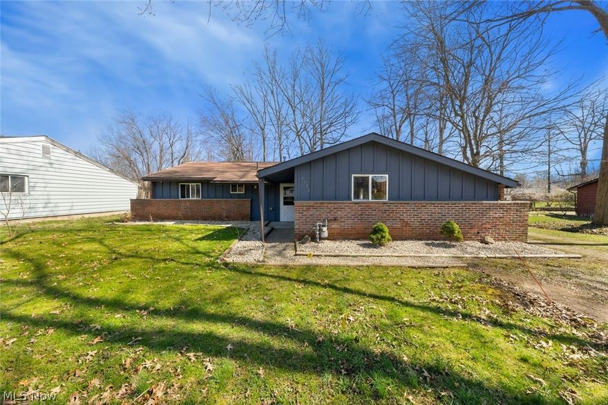 If you are ready for low maintenance, first floor living... then welcome to this charming ranch in Brimfield Township!  Just 2 minutes from Dussel's Farm, this home is situated on a dead end road and gives you that feel of peaceful living.  Entertain in the open floor plan, and enjoy the new (2022) screened in porch out back while you watch the family or the pups play in the fully fenced in back yard.  This home has been well cared for. Inside you will find a very spacious and large kitchen...owners recently installed a new sink, faucet, and gas stove.  Right off kitchen is your laundry nook, a small office space was added inside too.  Living space has been freshly painted, and new french doors installed (2023).  HWT new (2023).  Furnace and central a/c (2010).  Electrical panel, roof, windows, and gutters were all replaced/updated in 2009.   The 20x20 detached garage is insulated and has heating and cooling...perfect for everyday use or for your hobbies!  There is also a 8x10 storage shed behind garage for extra space.  Sellers are providing the new buyer with a 1 year home warranty!  This home needs nothing but for someone new to move in and make it their own!