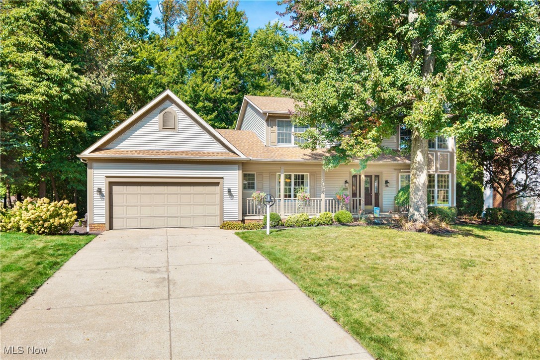 Welcome to this stunning 4-bed, 3-bath colonial nestled in the highly desirable Mayfair Lakes development, located within the Green Local School District. You’ll be charmed by the home’s timeless curb appeal, complete with a welcoming front porch accented by flower boxes and meticulous landscaping. Step into the two-story foyer, where an elegant chandelier and staircase set the tone for the home’s classic yet modern feel. To one side, the beautifully finished dining room flows into the updated kitchen (2018), featuring quartz countertops, trendy subway tile backsplash, stainless steel appliances, and ample storage. The thoughtful layout continues with multiple living spaces, including a formal living room, a cozy family room with built-in bookcases and gas fireplace, and a cheerful sunroom. A first-floor laundry and half bath add convenience to daily living. Upstairs, the expansive master suite is a private retreat with vaulted ceiling, walk-in closet, and updated ensuite bath. Three additional well-sized bedrooms and another full bath provide plenty of room for family or guests. The lower level offers incredible potential. The dry basement is already equipped with a supplemental gas heater and provides abundant storage. Finish this level to your liking and add up to 1,000 square feet of living space to this already spacious home. The backyard is a true highlight, offering a private, park-like oasis. Enjoy outdoor entertaining on the new (2021) paver patio with stone walls, or relax on the low-maintenance composite deck overlooking the lovely yard. A thoughtfully designed dry river bed not only handles seasonal water flow but also creates a beautiful, eye-catching creek feature at the back of the property. Additional updates include HVAC system, stove, roof, and whole house generator. With its combination of modern updates, abundant living space, and a stunning outdoor setting, this home is truly move-in ready and offers everything today’s buyers are looking for.