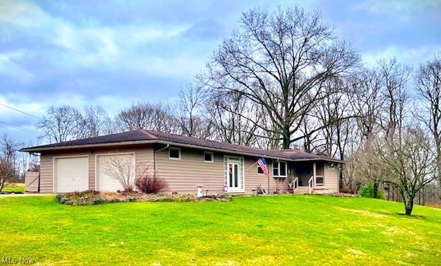 Are you in the market for a home that's move in ready with modern updates? Located in the East Muskingum School District don't let this 1864 sq ft home situated on a one acre lot pass you by. Located in the Ridgewood Acre subdivision you are sure to feel right at home from the moment you pull across the concrete driveway into the two car attached garage that makes unloading a breeze. You are sure to find a cozy feeling in the enclosed breeze way with patio doors on both sides that give you the option to take in the fresh air and warm breezes while still being able to use this space in the cooler seasons. The open concept kitchen and dining area make it a great atmosphere to entertain while still being close to the living room area with hardwood flooring that offers a warm atmosphere to relax, unwind and catch up with family and friends. Two bedrooms and the oversized owners suite all on the same level floor make it the perfect layout to remain connected. The owners suite with carpeted flooring and viewing windows of the wooded scenery make it a perfect place to unwind and relax, with its own outside exit to a large wooded deck this makes it a perfect area to escape the hustle and bustle of a busy day. The oversized owners suite also offers an area that gives room for a work at home office as well as a walk in closet. The two bedrooms with built in closets offer just the right size for an adult or child size bed & furniture. Be sure not to miss and appreciate the arched entry into the living room that add to the warmth this home offers. A large picture window in the living room lets the sunshine in and adds wonderful views from the outside. Downstairs you will find the wood burner and bar area.  This basement spot can easily become a favorite to many.  While downstairs you will also find a laundry area along with plenty of room to have a hobby work area.  Don't let this home opportunity in the Ridgewood subdivision pass you by schedule your viewing today.