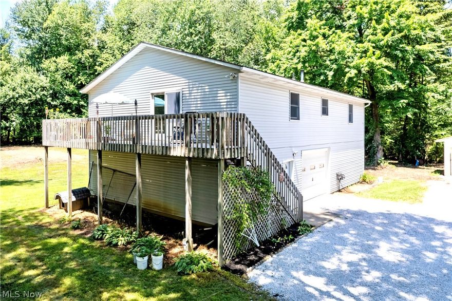 Welcome to your private oasis on 22.50 acres of serene beauty! This secluded property features a fully stocked 1-acre pond teeming with bluegill, bass and crappie, perfect for quiet afternoons of fishing. This peaceful, mostly wooded setting offers tranquility and a picturesque escape from the hustle and bustle. The raised ranch home includes 3 bedrooms, 1 bath, convenient 1st floor laundry and a deck that offers stunning views of the beautiful grounds. Enjoy the partially finished walk-out basement, which adds extra living space. Many recent updates include newer shingles, heat pump and a brand new patio door! The owners are also including a 1 yr. home warranty for added peace of mind. Imagine having your own business in the impressive 50x80 building, complete with 3-phase electric, a 1000 lb. rotating electric hoist, 12' overhead door and a finished second floor perfect for office space and additional storage. Located within the esteemed Smithville School District, this property seamlessly blends natural beauty with practical amenities. Whether you're looking to relax by the pond, explore the wooded acreage or launch your next business adventure, this unique property offers endless possibilities.