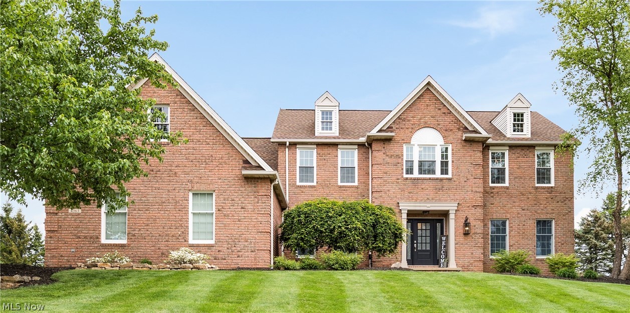 Welcome to this completely renovated custom-built home overlooking the picturesque Fox Meadows Country Club! This stunning property boasts an array of recent upgrades and meticulous attention to detail throughout. Enjoy peace of mind while enjoying the Country Club Lifestyle with a new roof featuring a 50-year warranty, new windows upstairs, a new front door, a new side door, new garage doors and opener, HVAC, and an 80-gallon hot water tank. Step inside to discover newly installed carpeting (2023) and gleaming hardwood floors complemented by Kichler lighting throughout the home, creating an inviting atmosphere in every room. Experience luxury in the remodeled bathrooms featuring tile showers, while the custom-built master closet offers ample storage space. The laundry area has been thoughtfully redesigned with built-in lockers for added convenience. Entertain in style in this one-of-a-kind finished basement, complete with a half bath, pool table, theater area, custom Speakeasy Bar, stone fireplace, and workout space. Upstairs, a media room awaits with a built-in entertainment center and desks, perfect for movie nights or remote work. Step outside to the screened porch and outdoor living area, ideal for enjoying the serene surroundings. Warm up by the wood burning custom stone fireplace in the family room, featuring a rustic barn beam mantel for added charm. Additional features include updated craftsman trim, new interior doors with hardware, and replaced outlets and light switches throughout, all finished with elegant Brazilian hardwood floors. This house is the epitome of luxury living. Schedule your private showing and see all of the charm this home has to offer.