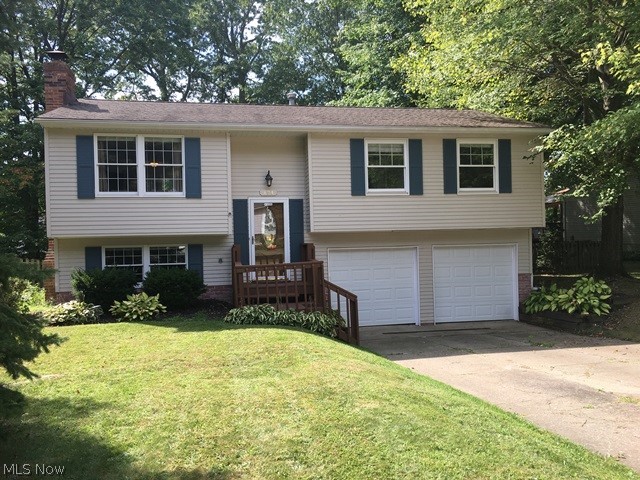 Very well maintained raised ranch in desirable area of Munroe Falls close to shopping, schools, restaurants, parks and library. This seller has lovingly cared for their home but have outgrown it. Home has been freshly painted inside and power washed and painted deck and front porch. There are new garage doors and openers. In 2017 there was a new furnace and air conditioning. Their children love the back yard. It is totally fenced in and lots of room for pool, swing sets and more.
